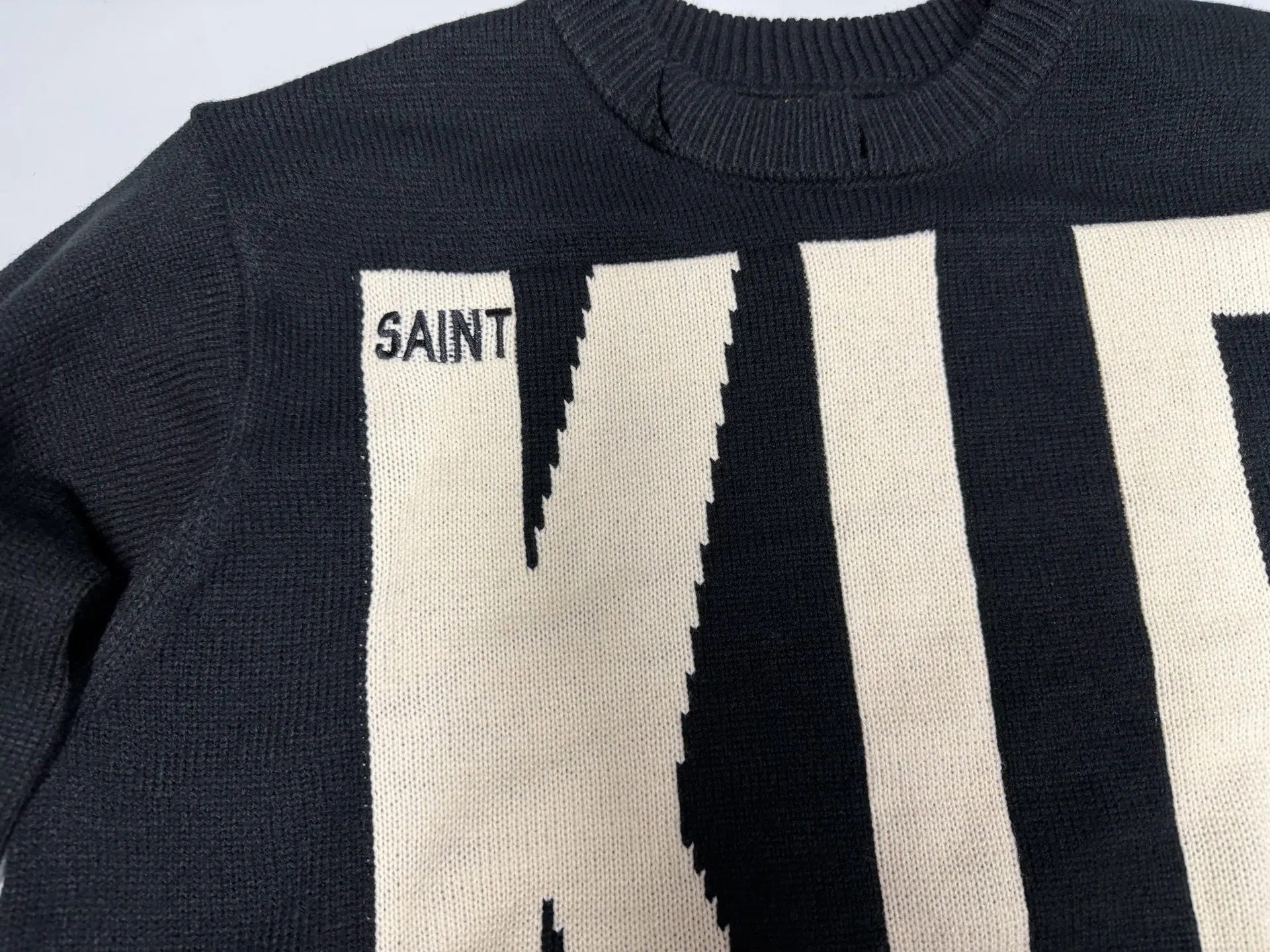 ❥4040#P240 New Saint Michael ✖️ KLF destroyed sweater made of black sheepskin material, KLF saint embroidery on the front, super visual impact! Distressed design, full of street feel, same style for men and women, a must-have for autumn and winter wear. Dark style + unique artistic sense, fashionable people and celebrities are picking it up, it looks cool if you wear it casually! Craftsmanship: The whole piece is cut and aged by hand, very slow! Weight: 900g Color: Black Size: S M L XL